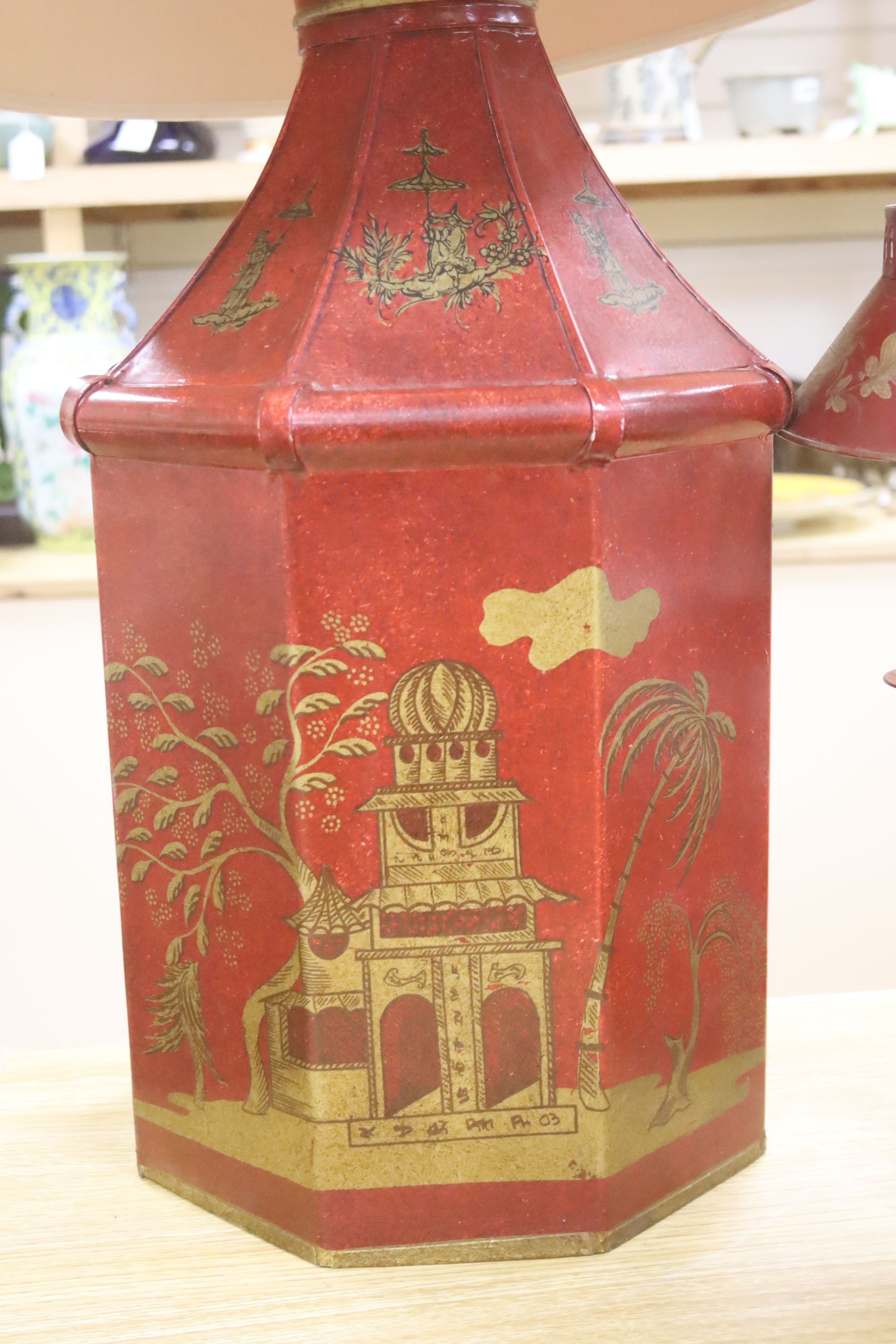 A pair of toleware student's lamps and one other, height 52cm excl. light fitting